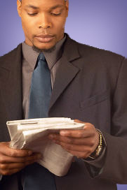 Man reading newsletter